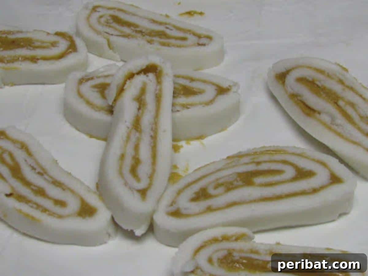Slices of old-fashioned homemade potato candy, rolled with peanut butter, resembling a jelly roll.