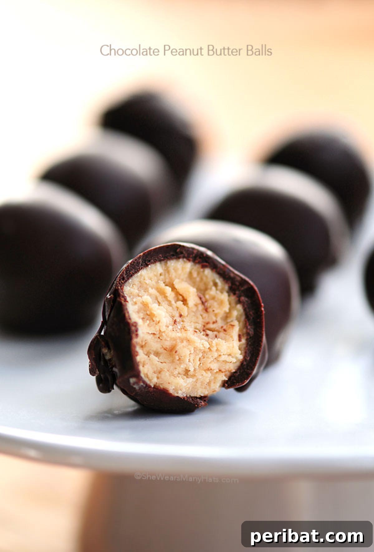 Homemade chocolate-dipped peanut butter balls, also known as buckeyes, arranged on a festive plate.