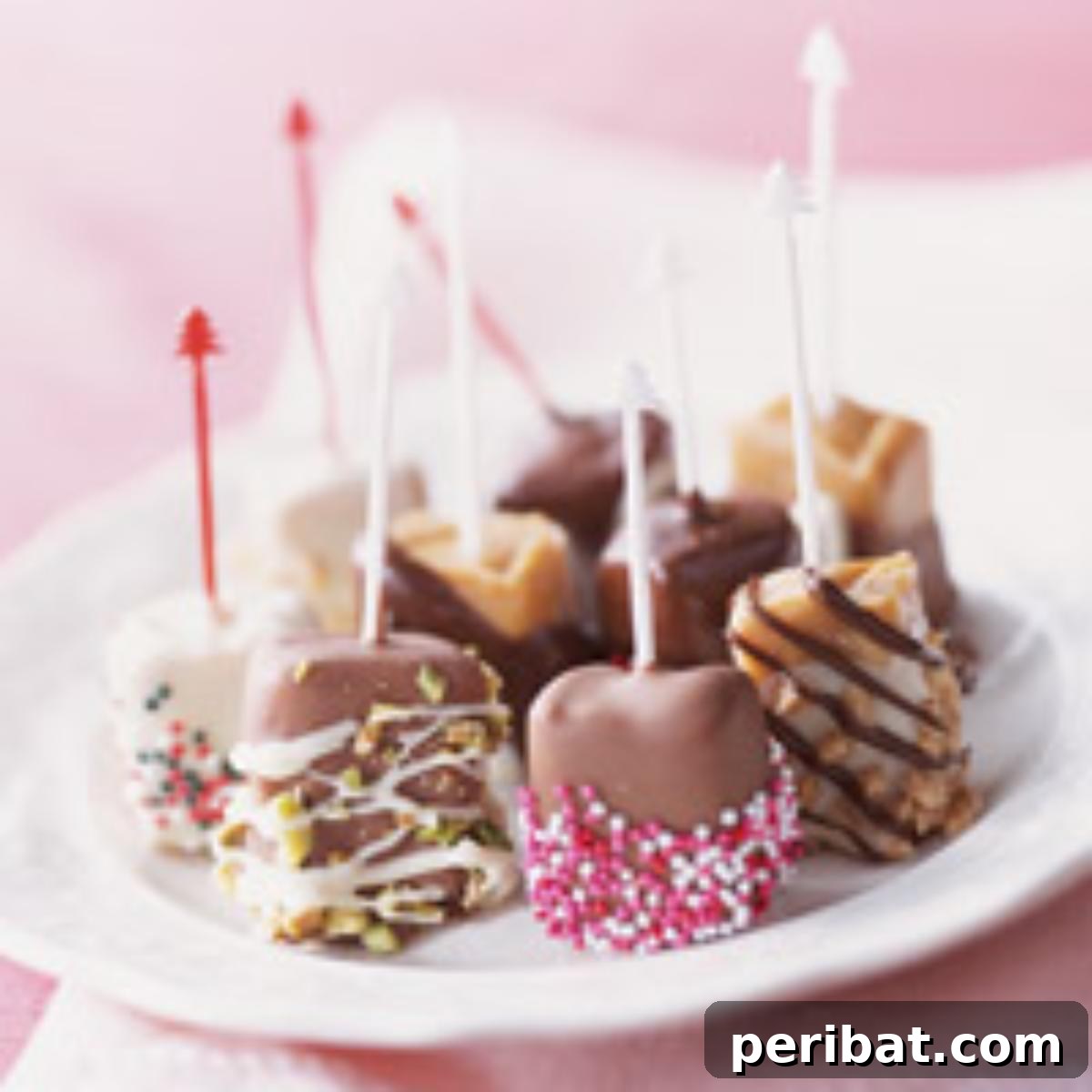 Gourmet candied caramels on lollipop sticks, dipped in chocolate and adorned with festive sprinkles.