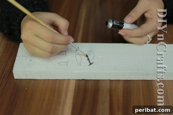 Craft Your Own Rustic Christmas Snowman 7 Painting snowman eyes and mouth with black paint