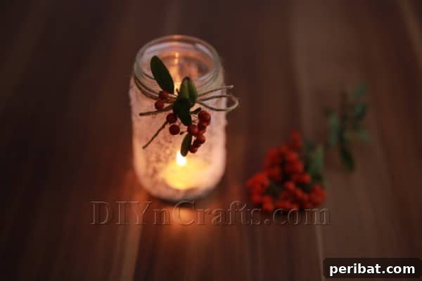 A close-up of the completed Wintry Frozen Candle Jar Decoration, glowing beautifully and ready to enhance holiday ambiance.