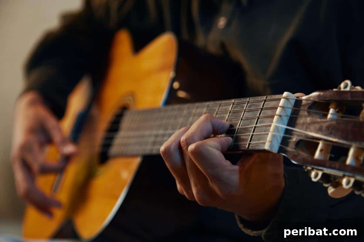 Master 28 Vital Life Skills in Days 12 Person strumming chords on an acoustic guitar