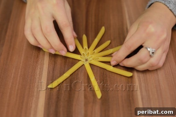 Dazzling Pasta Snowflake Christmas Ornaments 12 The fully constructed pasta snowflake structure for Design #1, ready for painting.
