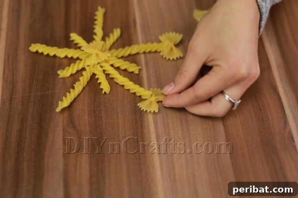 Dazzling Pasta Snowflake Christmas Ornaments 24 Gluing small bow-tie pasta pieces to the ends of the spiral arms for a decorative finish.