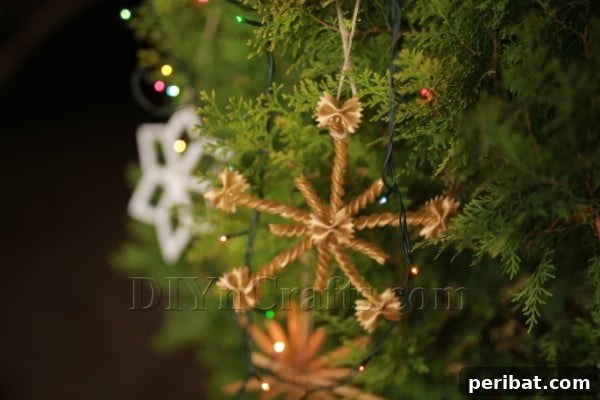 Dazzling Pasta Snowflake Christmas Ornaments 30 A close-up view of an elegant golden pasta snowflake ornament, highlighting its detailed structure.