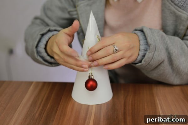 DIY Adorable Miniature Christmas Trees 11 Taping ball ornaments onto the cone
