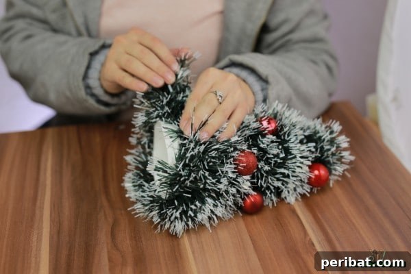 DIY Adorable Miniature Christmas Trees 13 Wrapping garland around ornaments on the cone