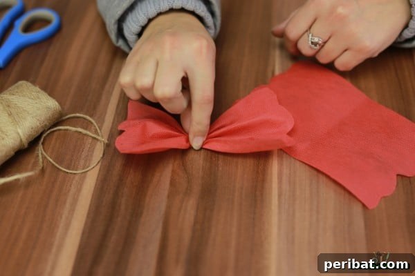 DIY Adorable Miniature Christmas Trees 16 Tying the fabric with twine to form a bow