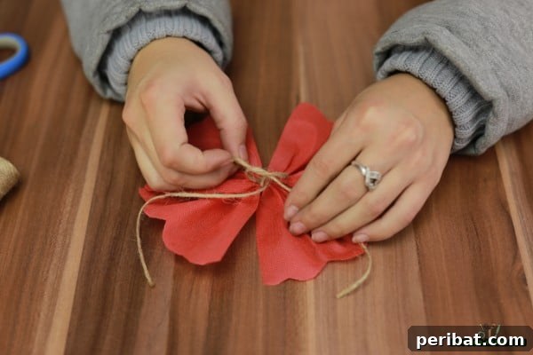 DIY Adorable Miniature Christmas Trees 17 Adding a small bell to the bow
