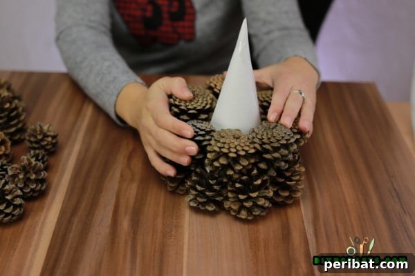 Step 5: Staggering the second layer of pinecones
