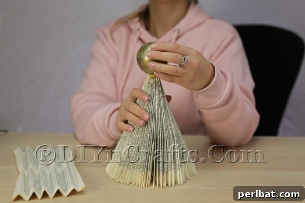 Upcycle an Old Book into a Stunning Christmas Angel 12 Angel's head securely attached to the book body