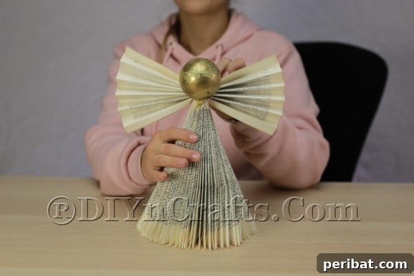 Upcycle an Old Book into a Stunning Christmas Angel 14 Angel with wings attached, ready for embellishments
