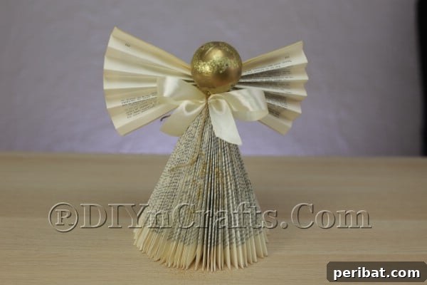 Upcycle an Old Book into a Stunning Christmas Angel 20 Finished book angel with sparkling glitter on her gown