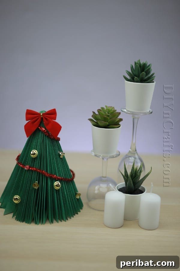 Pages to Pine: Craft a Christmas Tree from Old Books 11 Finished upcycled book Christmas tree with a bow