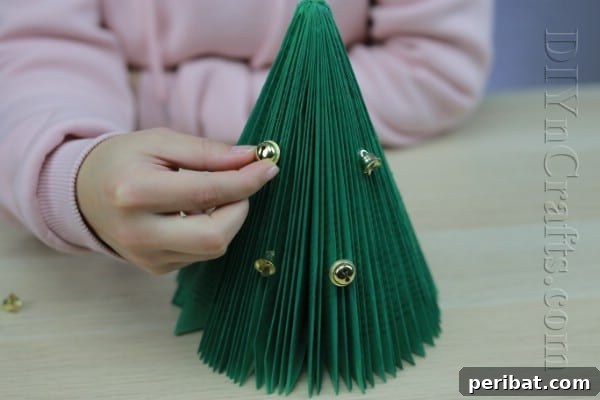 Pages to Pine: Craft a Christmas Tree from Old Books 9 Adding more decorations to the book Christmas tree