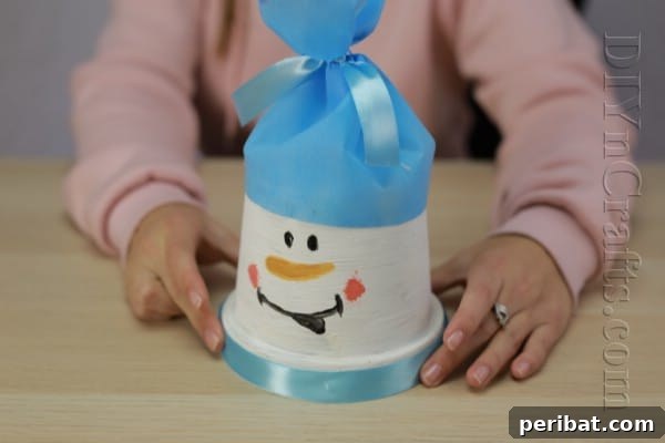 DIY Adorable Flower Pot Snowman 12 Flower pot snowman with scarf