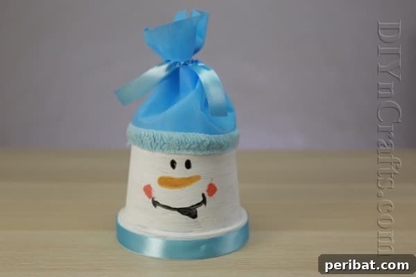 DIY Adorable Flower Pot Snowman 13 Add furry trim to the hat for extra charm
