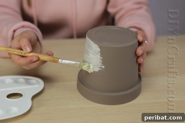 DIY Adorable Flower Pot Snowman 5 Paint the flower pot white