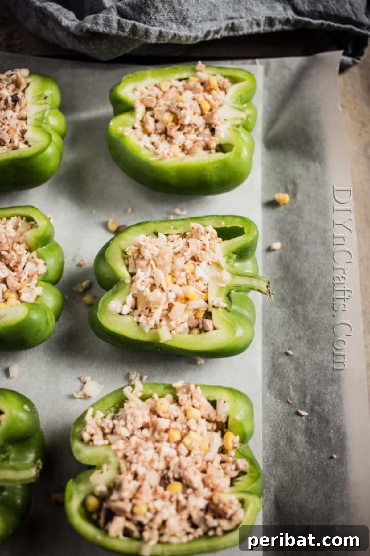 Golden Cheesy Mushroom Cauliflower Stuffed Peppers 6 Adding the filler to the peppers.