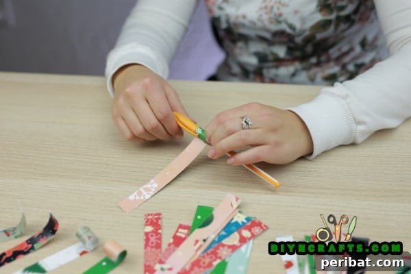Miniature Cardstock Strip Christmas Tree Craft 12 Curling one end of the cardstock strips using a pen