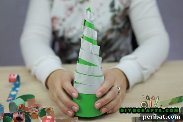 Miniature Cardstock Strip Christmas Tree Craft 14 Close-up of double-stick tape applied to the cone