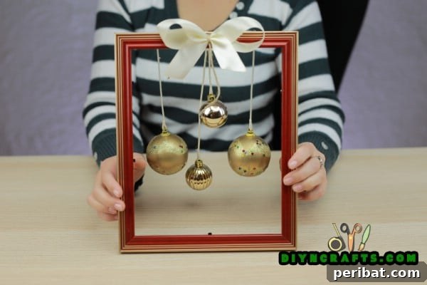 Completed Christmas picture frame wreath with a bow