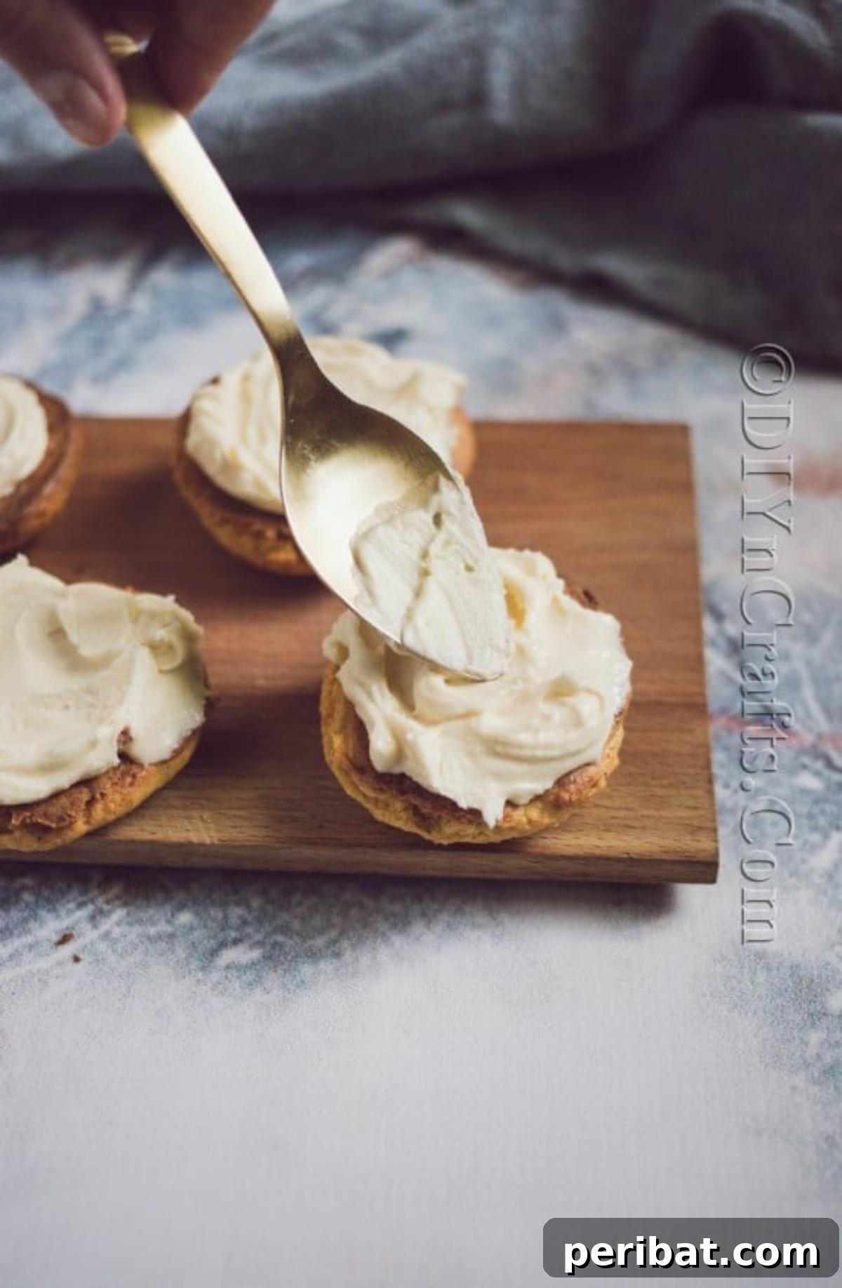 Cozy Fall Pumpkin Cookies Recipe 7 Preparing the creamy filling: softened cream cheese, butter, powdered sugar, and salted caramel being mixed until smooth.