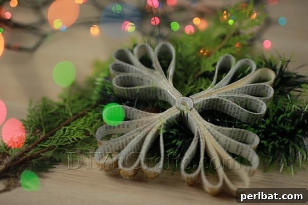 Creative Snowflakes From Vintage Book Pages 18 A completed, elegant snowflake ornament crafted from book pages.