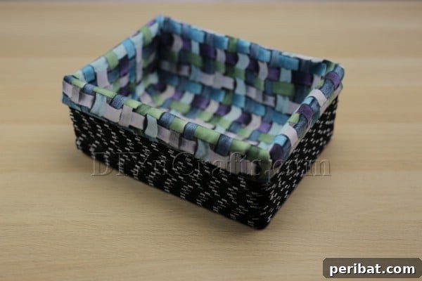 Cardboard Box Makeover: Create a Stylish Storage Basket 14 The finished upcycled cardboard box transformed into a stylish storage basket.