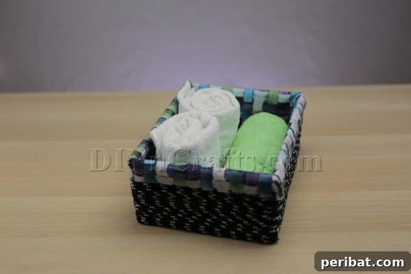 Cardboard Box Makeover: Create a Stylish Storage Basket 16 The interior of the finished fabric-lined storage basket.