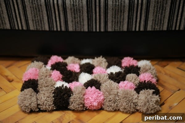Finished fluffy pom pom rug