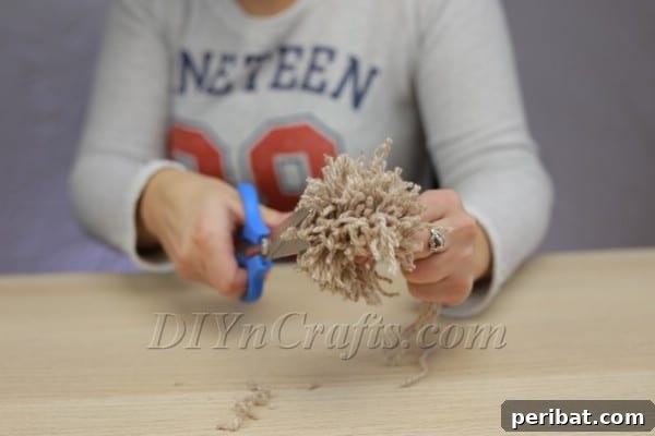 All loops cut, forming a basic pom pom