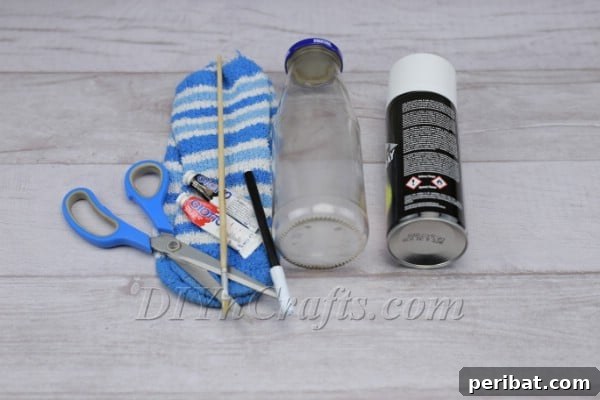 Transform Bottles into Cute Snowmen 4 Spray painting the bottle uniformly white to create the snowman's snowy body base