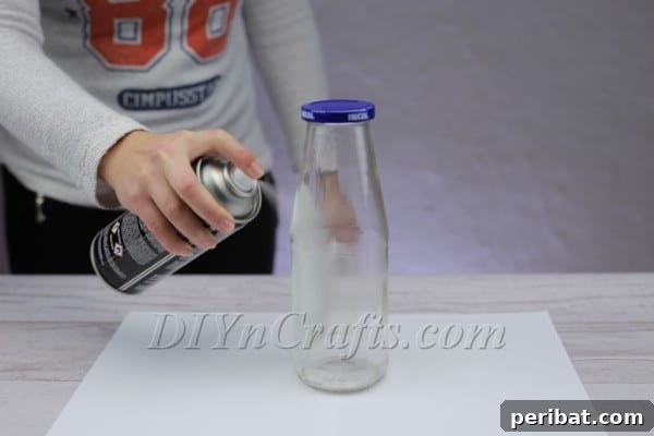 Transform Bottles into Cute Snowmen 5 Clean, evenly white painted bottle ready for snowman decoration