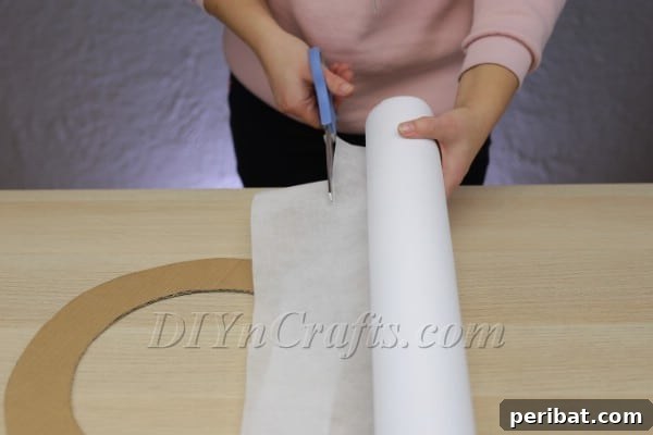 Create A Rustic Cardboard And Yarn Christmas Wreath 6 Making small yarn balls for wreath decoration.