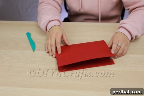 Transform Construction Paper into Festive Poinsettias 5 Step 2a: Folding back the top section