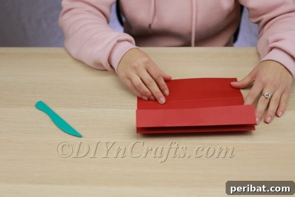 Transform Construction Paper into Festive Poinsettias 6 Step 2b: Flipping and repeating on the other side