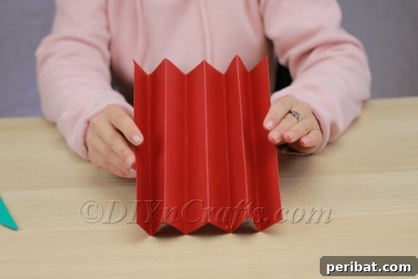 Transform Construction Paper into Festive Poinsettias 7 Step 3: Continuing the accordion folds