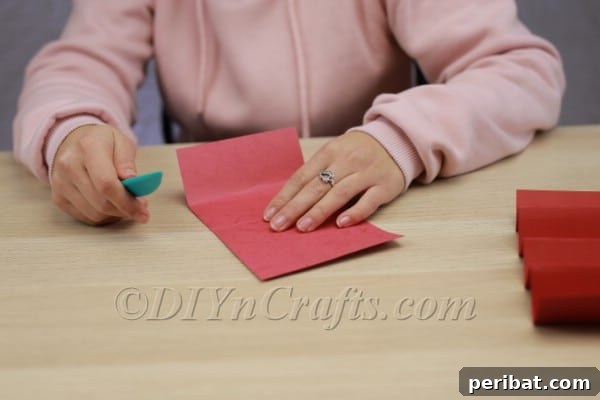 Transform Construction Paper into Festive Poinsettias 8 Step 4a: Folding the smaller paper