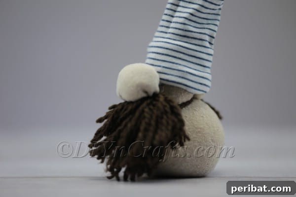 Craft Your Own Scandinavian Rice Sock Gnome 20 The fully assembled DIY Scandinavian Christmas gnome, showcasing its charming details