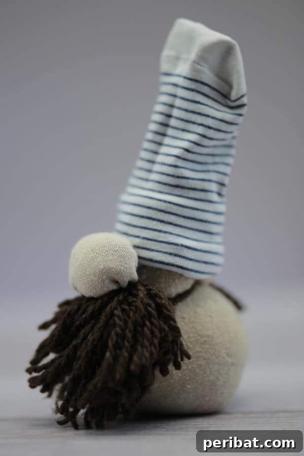 Craft Your Own Scandinavian Rice Sock Gnome 4 Beautifully crafted Scandinavian Christmas gnome with a long beard and tall hat