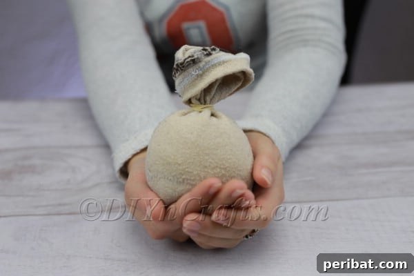 Craft Your Own Scandinavian Rice Sock Gnome 6 Sock filled with rice, securely tied off with a rubber band at the top