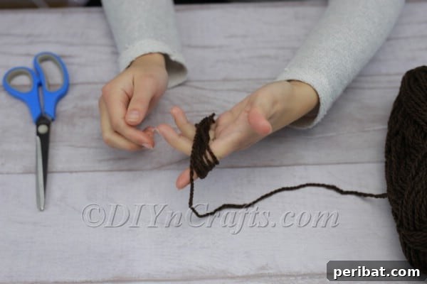 Craft Your Own Scandinavian Rice Sock Gnome 7 Winding yarn repeatedly around the hand to create a thick bundle for the beard