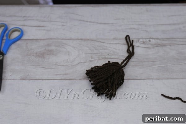 Craft Your Own Scandinavian Rice Sock Gnome 8 Cutting through all the yarn loops with scissors to form individual strands for the beard