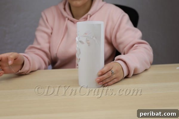 Handcraft a Luminous 3D Paper Lantern 9 Wrapping the 3D paper design around a glass jar