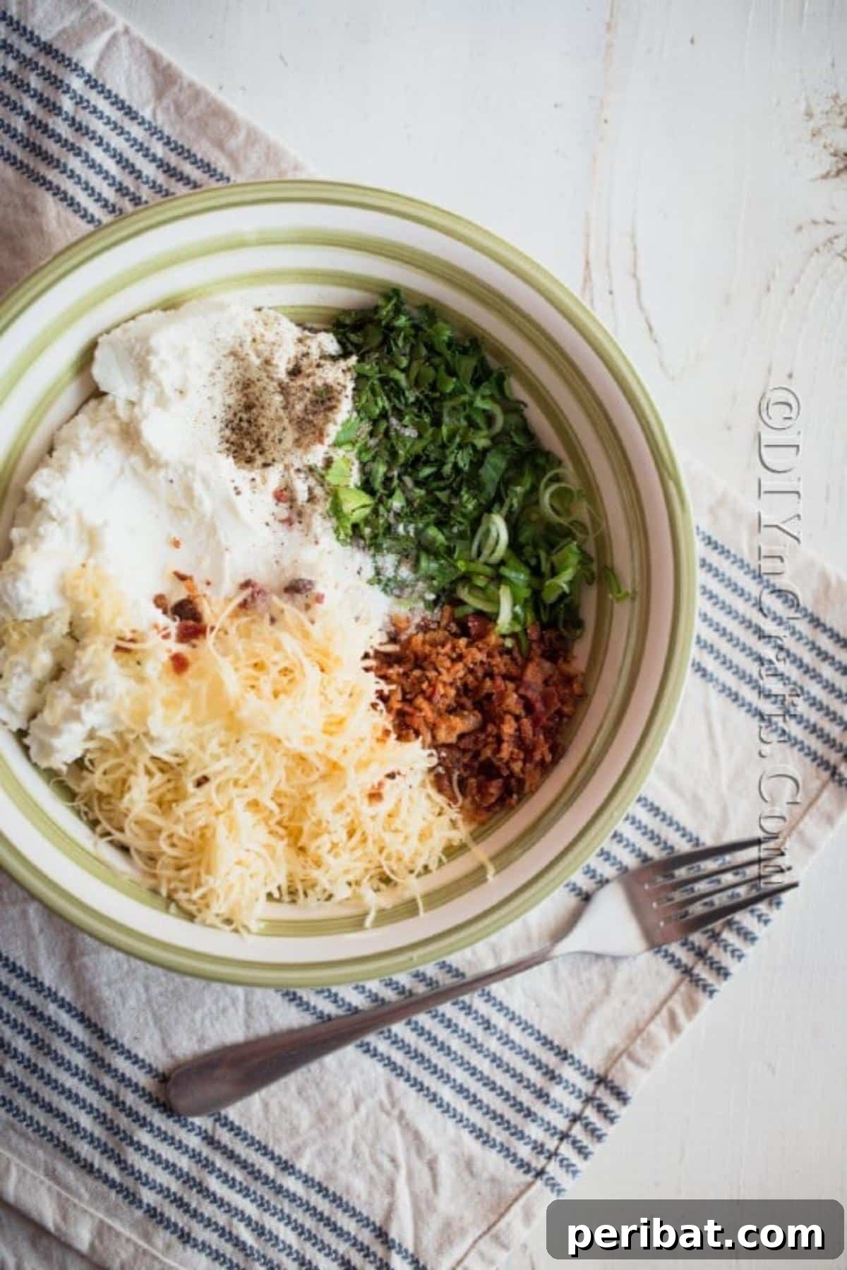 The Ultimate Party Cheese Ball 4 Combining cream cheese, shredded cheddar, cooked bacon, ranch seasoning, and green onions in a mixing bowl.
