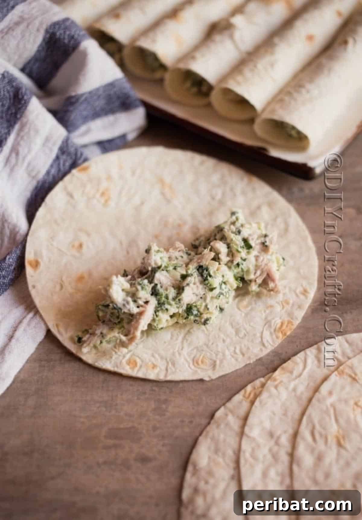 Effortless Crispy Chicken Taquitos 5 Filling corn tortillas with chicken mixture for taquitos