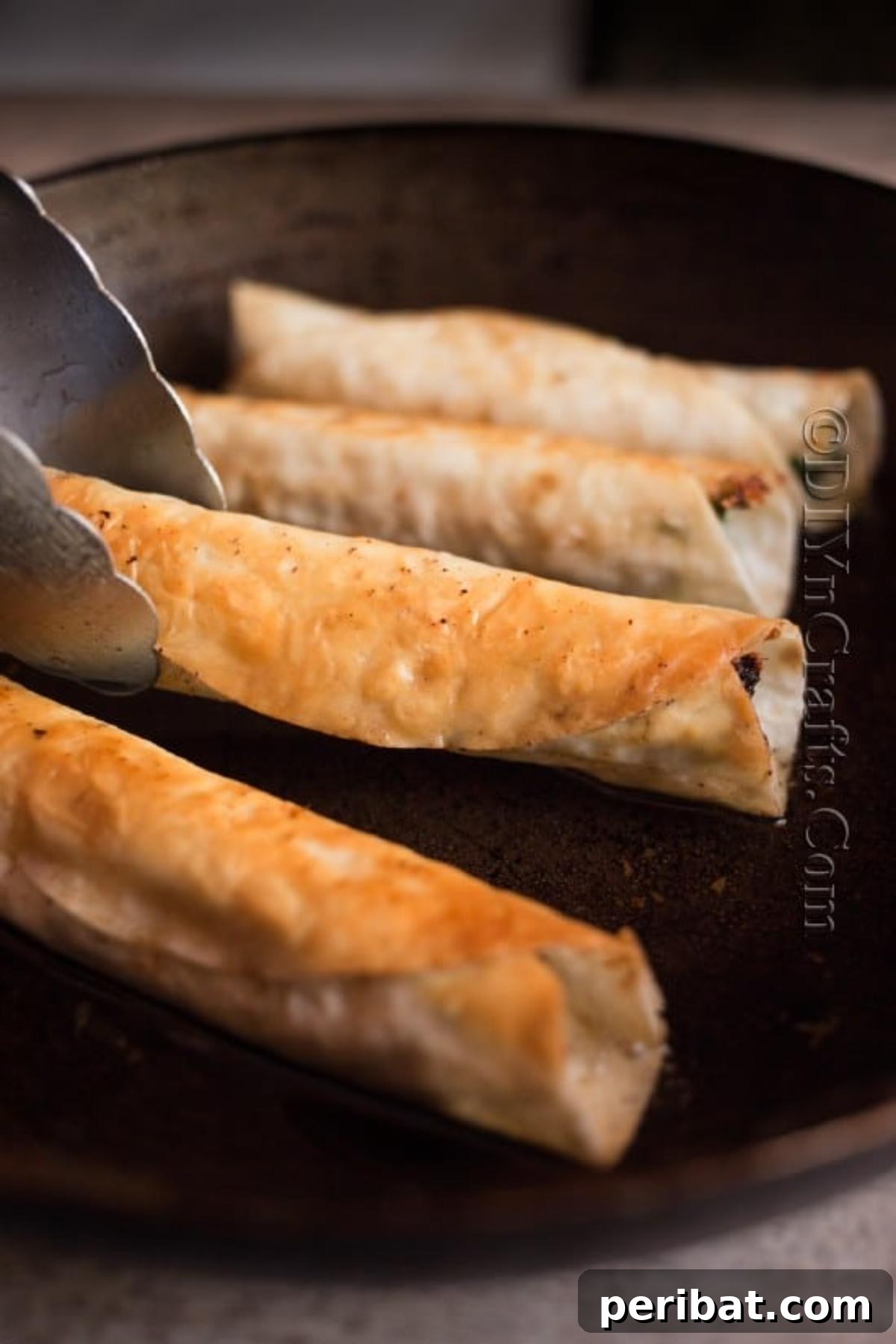 Effortless Crispy Chicken Taquitos 6 Frying chicken taquitos in hot oil until golden brown