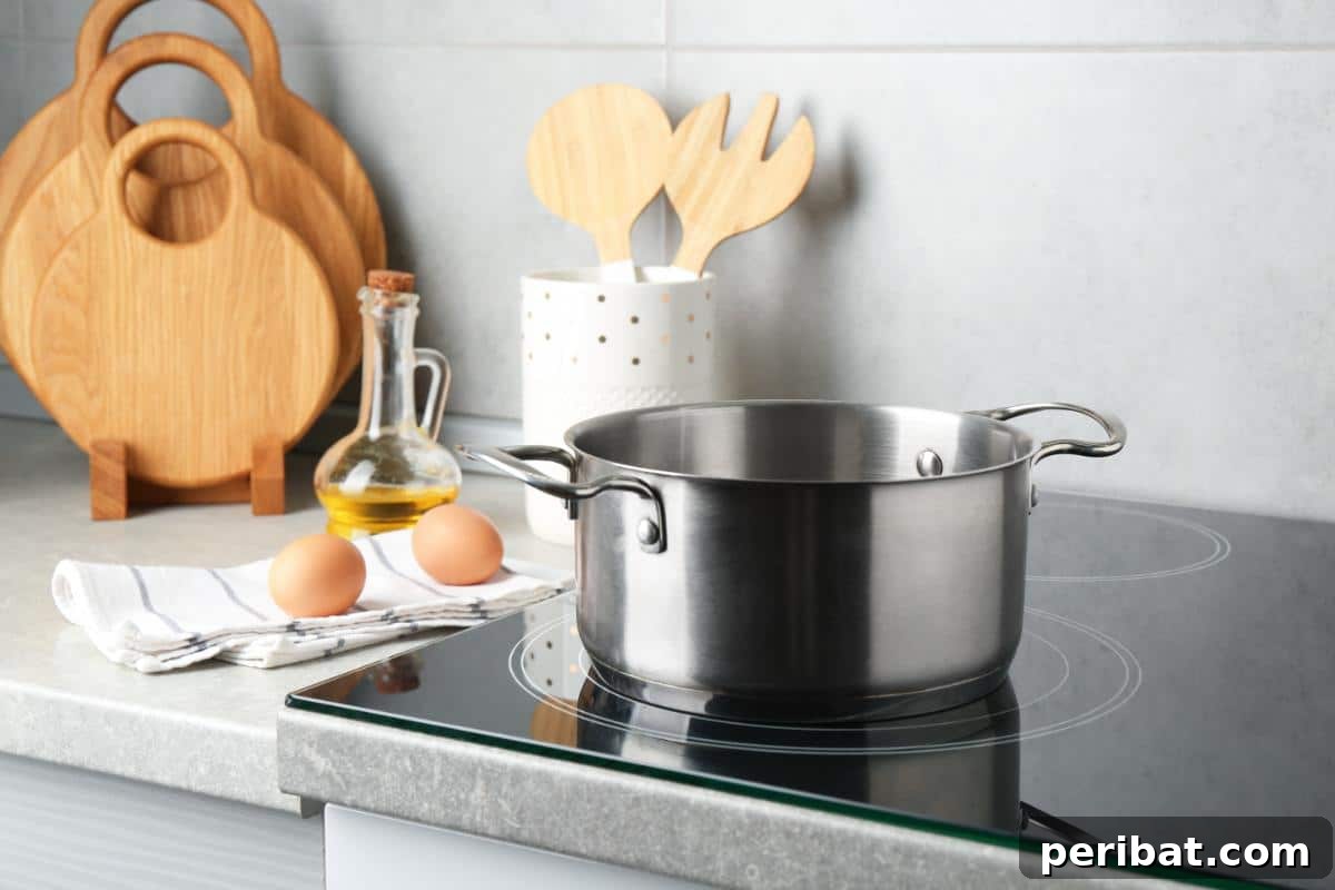 Beyond the Bin: 20 Brilliant Ways to Repurpose Fruit and Vegetable Peels 11 A shiny metal cooking pot on a stove.