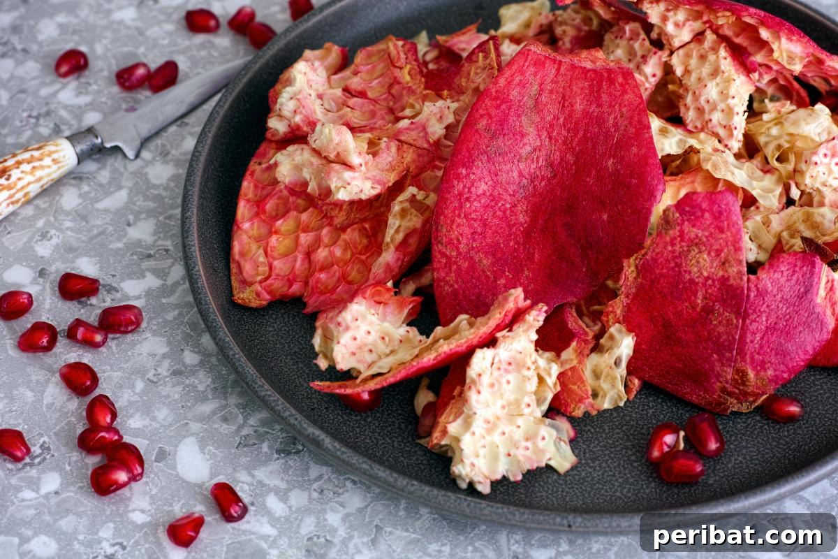 Beyond the Bin: 20 Brilliant Ways to Repurpose Fruit and Vegetable Peels 17 A plate with pomegranate peels.